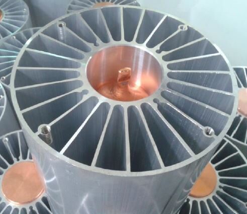 Round extruded LED cooler with embedded copper heat pipe core